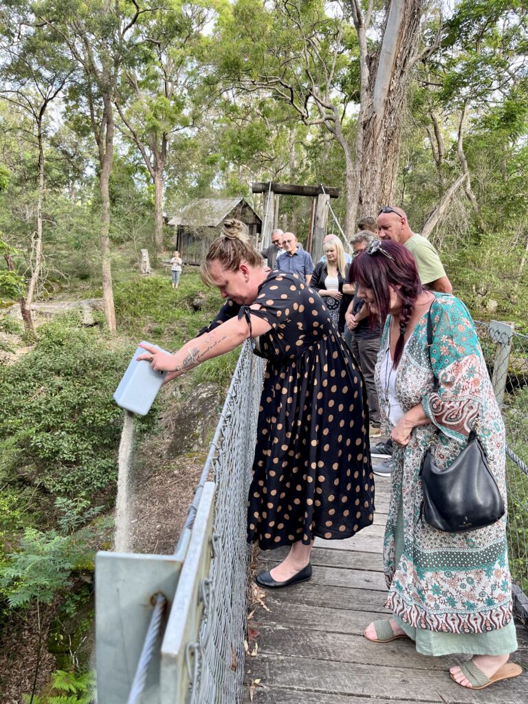 Mike Wolstenholme ashes being spread in bushland
